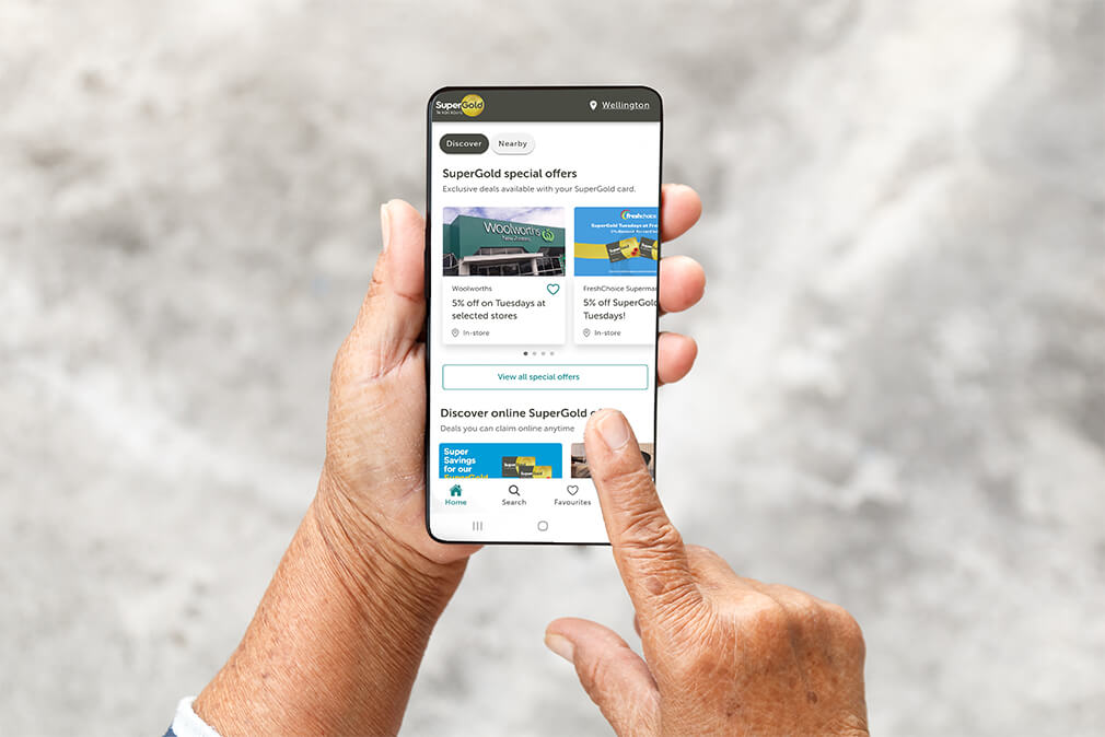 Hands holding a smart phone with the SuperGold app open